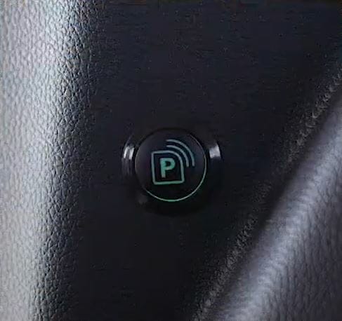Closeup image of the button inside a VMI wheelchair van that activates parksmart parking assist