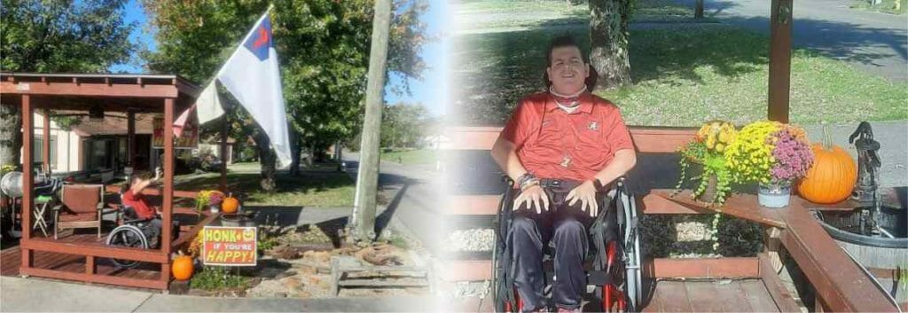 Jake Stitt sitting in wheelchair in front of his home in Tenneessee