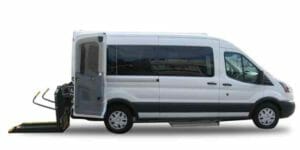 Side view of White ford transit ADA Full-size van