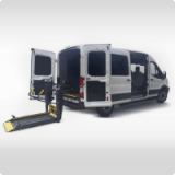image of ford transit ADA wheelchair van with wheelchair lift deployed from rear