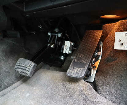 image of a left foot accelerator inside a vehicle