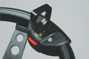 Amputee ring handicap steering device mounted on a steering wheel.