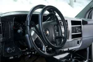 Handicap Driving aid. Steering wheel extension mounted to a steering wheel.