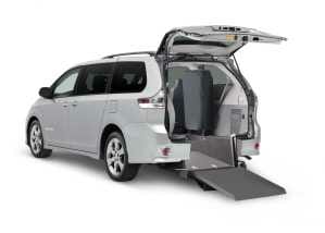 Rear view of a silver Toyota Sienna Wheelchair Van with ramp out
