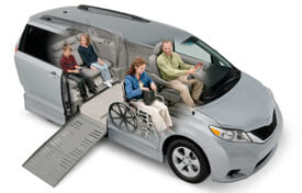 Silver wheelchair van with family inside