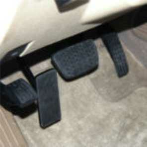 Adaptive driving equipment. Image of a left foot accelerator installed in a car.