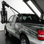 Image of power bed topper on pickup truck with wheelchair lift