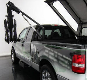 Image of power bed topper on pickup truck with wheelchair lift