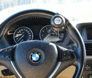 handicap driving aid. Image of spinner knob on steering wheel