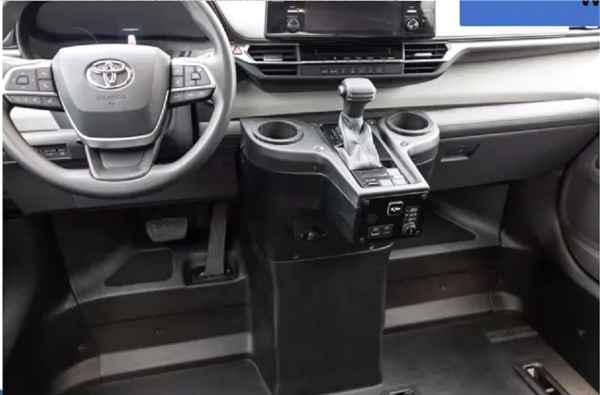 Front center console area of a 2021 Toyota Sienna Hybrid BraunAbility Wheelchair Van