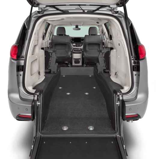 Closeup inside Pacifica rear-entry wheelchair van showing mid-row seats folded to the side