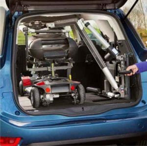 Smart Lifter scooter lift installed in the hatchback of a blue vehicle