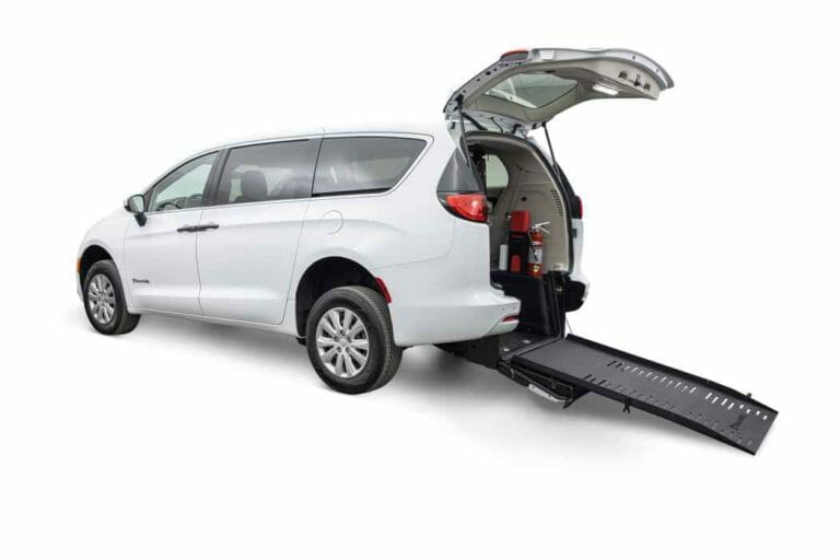 white, BraunAbility Chrysler Voyager Rear-Entry ADA wheelchair van with ramp out