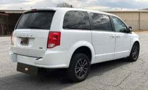 White dodge caravan with an Adaptive Vans rear-entry wheelchair conversion