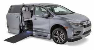 Silver VMI Honda Odyssey wheelchair van with ramp out