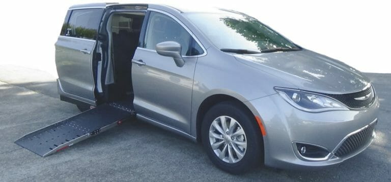 Silver Chrysler Pacifica wheelchair van from Adaptive vans with ramp out