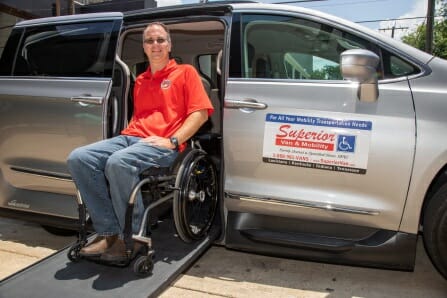 Matt Cole, U.S. Marine Corps veteran in wheelchair on ramp of wheelchair van